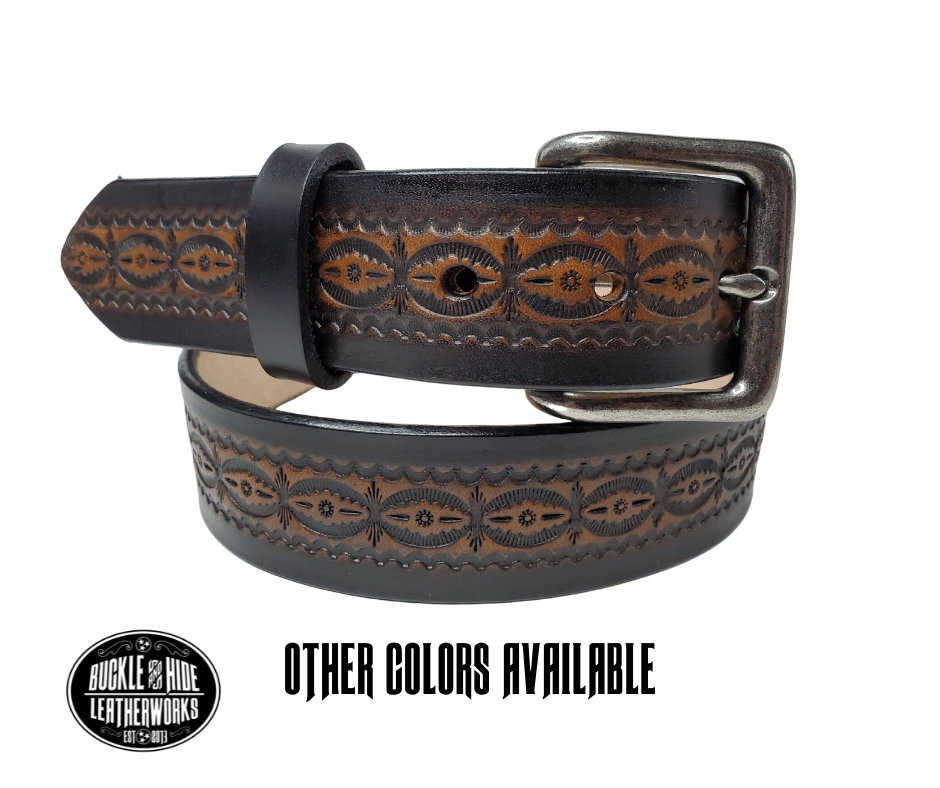 This handmade real leather belt is made from black, drum dyed cowhide shoulder that is 8-9 oz. or approx. 1/8" thick.  It is 1 1/2" wide and has a vintage design embossed on the surface with smoothed and burnished edges. The antique nickel plated solid brass buckle is snapped in place. Made just outside Nashville, in Smyrna, TN, you will find it is one of the longest lasting belts you will own.  It is made from a single strip of leather and is perfect for either casual or dress w