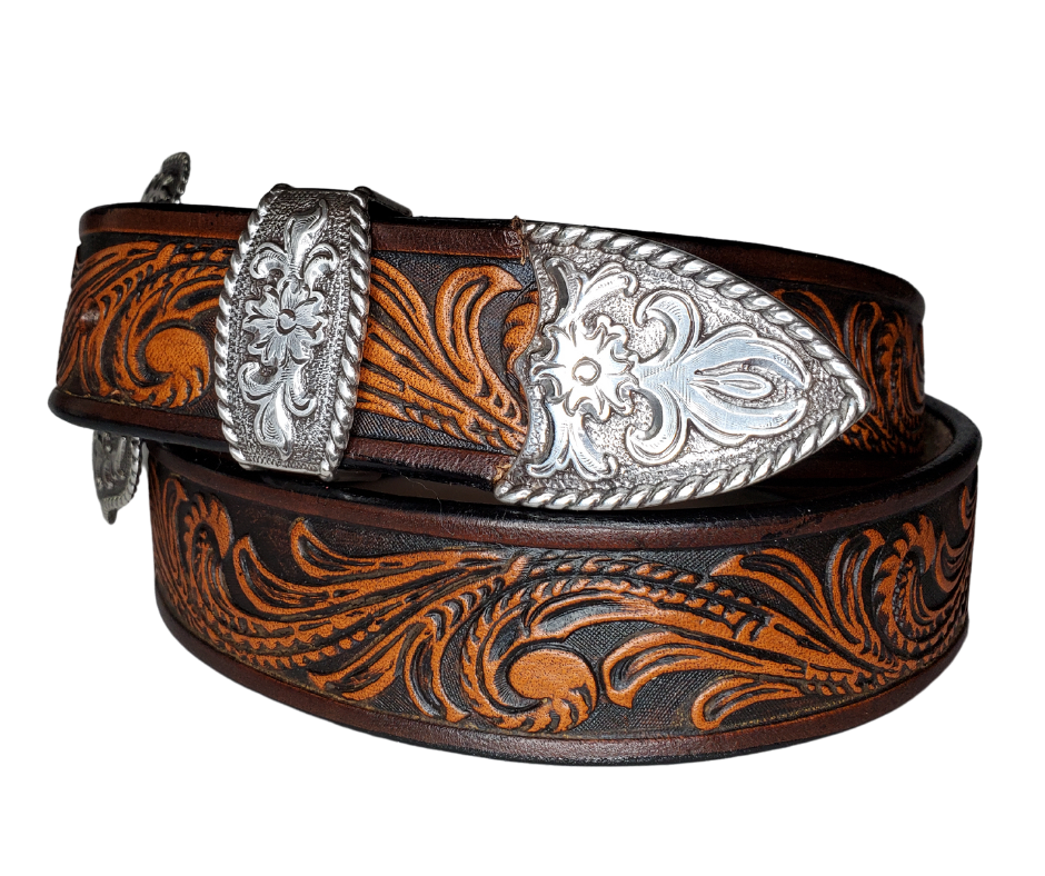 The "Rustler" design is one of our best sellers. But we've added a Classic Western 3 piece buckle set in Antique Nickel that looks great on plain 1 1/2" Black or Brown belt. An easy to wear shape that's not too big, measures approx. 3 7/8" wide by 2 1/2" tall. Belt is made from a single strip of leather in our shop in Smyrna, TN. Buckle is Imported. Available in our shop just outside Nashville in Smyrna, TN as well as online.