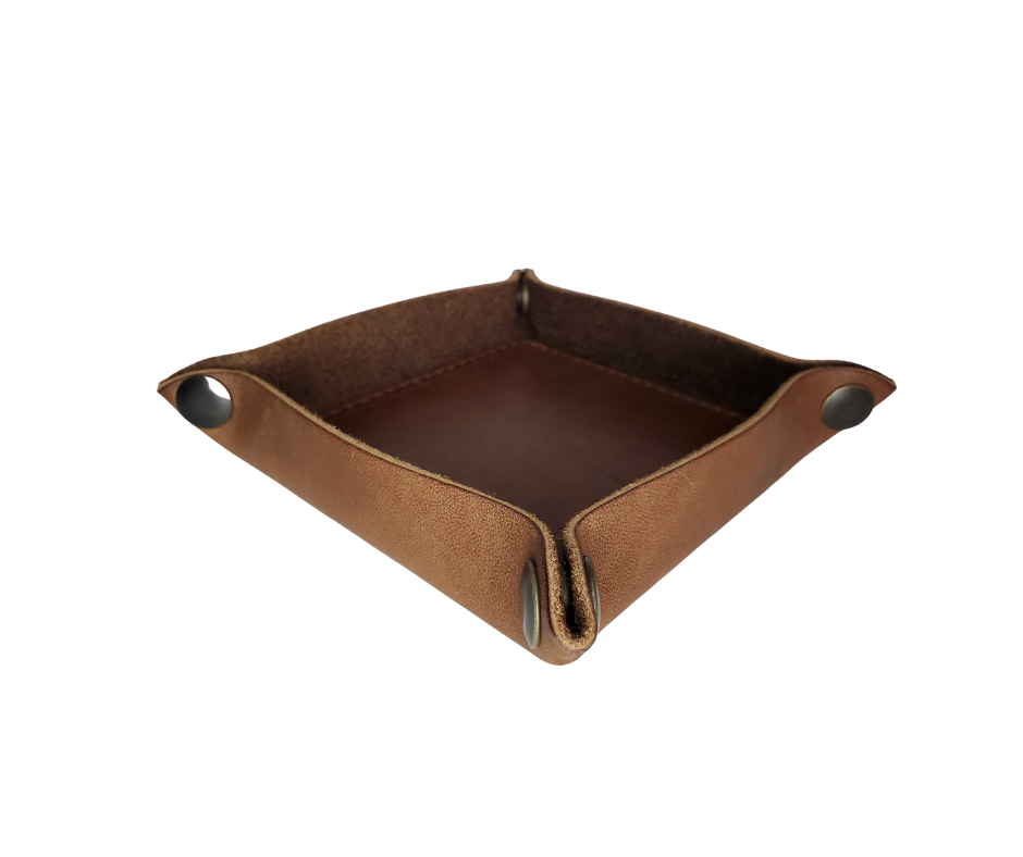 This handmade real leather valet tray has Antique Brass SNAPPED corners to FLATTEN out for easy packing for travel. It is made in our Smyrna, TN shop just outside Nashville.  The Stitched inside leather matches the outside for rustic look. It is a perfect catch-all for keeping keys and other small items in one place at the end of a long day.  Makes a great gift for groomsmen, or that special someone. ADD 3 initials, Available in 2 sizes. If you want 3 initials added, please type in CUSTOM box.