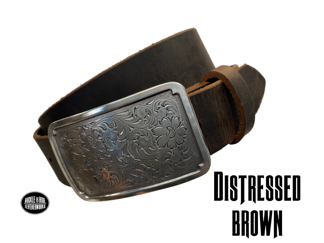 Rectangular antique silver belt buckle with western style tooling, size approx. 3" wide by 2 1/2" tall. Belt is handmade from a single strip of leather in our shop. Belt colors available are distressed brown, black, and dark brown. Buckle snaps in place for easy changing if desired.﻿ CHOOSE ONE BELT STRIP COLOR! Available online and at our shop just outside Nashville in Smyrna, TN.