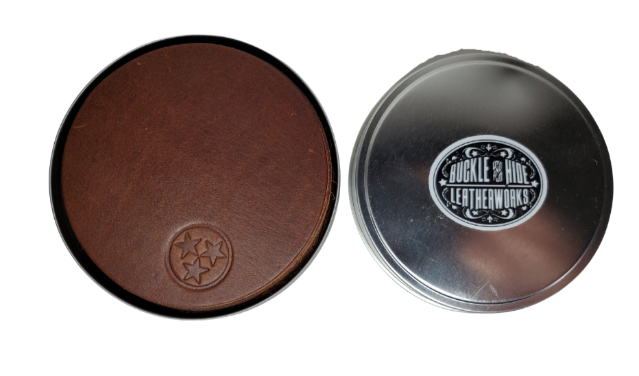 Made in our shop in Smyrna, TN just outside Nashville TN. Real cowhide approx. 3/16"thick in a 3 5/8" diameter coaster.  Embossed with famous Tennessee Tri-Star emblem10 coasters in a tin case. Great for groomsmen gifts, Weddings, Events and more. Contact us for bulk purchases of 50 or 500...