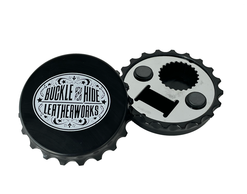 Black "Bottle Cap shaped" Magnetic bottle opener with white Buckle and Hide Oval logo. Available online or in our shop just outside Nashville in Smyrna, TN.