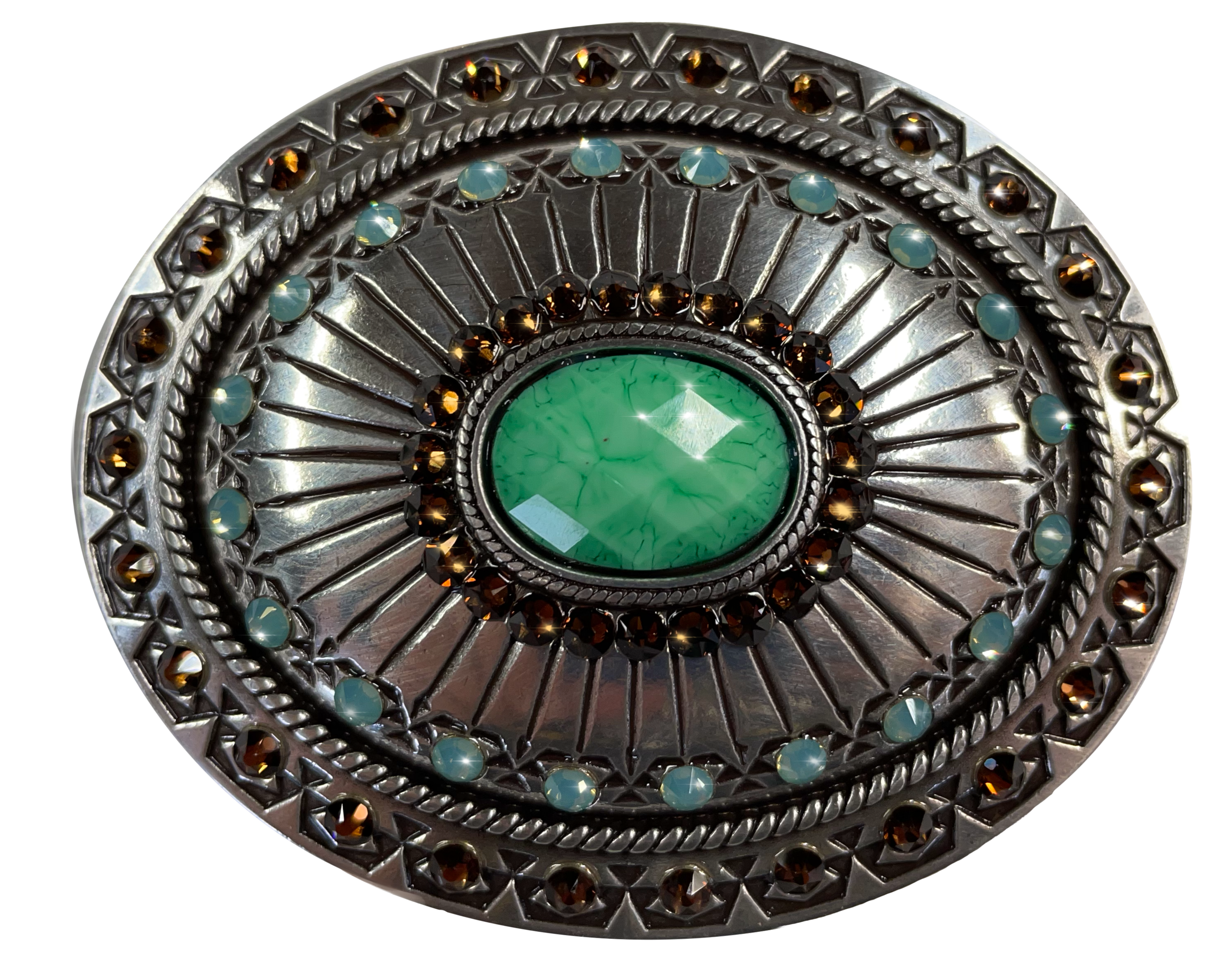 This oval buckle by Nocona's Blazin' Roxx measures 2 1/2" tall by 3" wide. Background color is chrome.  It has a decorative turquoise colored stone in the center surrounded by brown crystals, Lines radiate from the center outward and more turquoise colored crystals are then around the buckle with a rope design separating them from the edge of the buckle, which has another row of brown crystals in the design.  Available online and in our retail shop in Smyrna, TN, just outside of Nashville. 