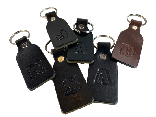 Small Leather keychain embossed with your choice of single letter initial. Great for identifying luggage, backpacks, or you keys! Available in Black or Assorted Brown. Put initial/s in the box. Made in our Smyrna Tn. shop.