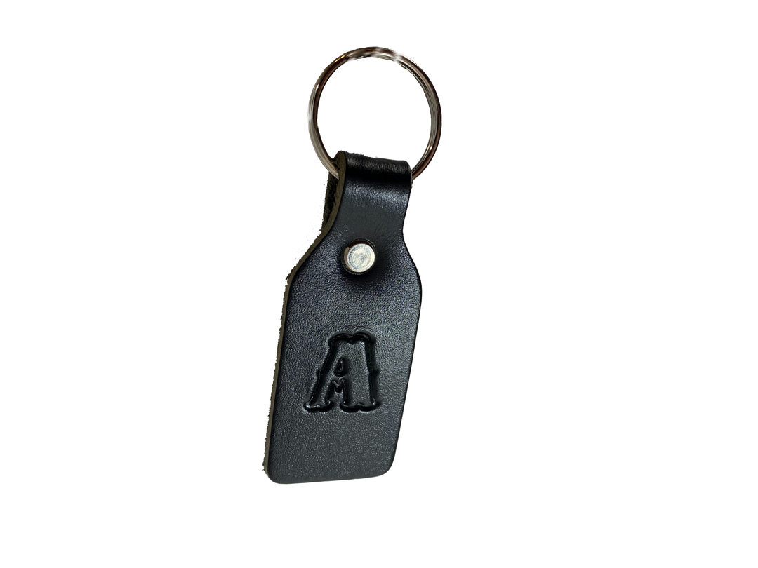 Small Leather keychain embossed with your choice of single letter initial. Great for identifying luggage, backpacks, or you keys! Available in Black or Assorted Brown. Put initial/s in the box. Made in our Smyrna Tn. shop.