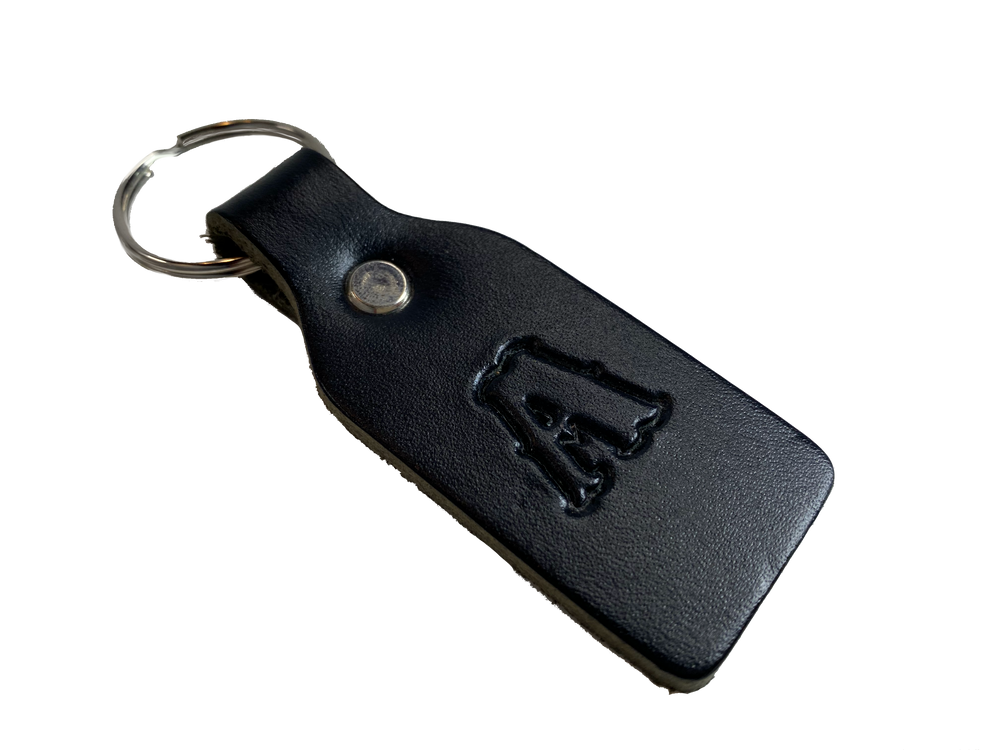 Small Leather keychain embossed with your choice of single letter initial. Great for identifying luggage, backpacks, or you keys! Available in Black or Assorted Brown. Put initial/s in the box. Made in our Smyrna Tn. shop.