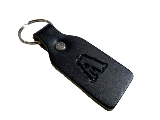 Small Leather keychain embossed with your choice of single letter initial. Great for identifying luggage, backpacks, or you keys! Available in Black or Assorted Brown. Put initial/s in the box. Made in our Smyrna Tn. shop.