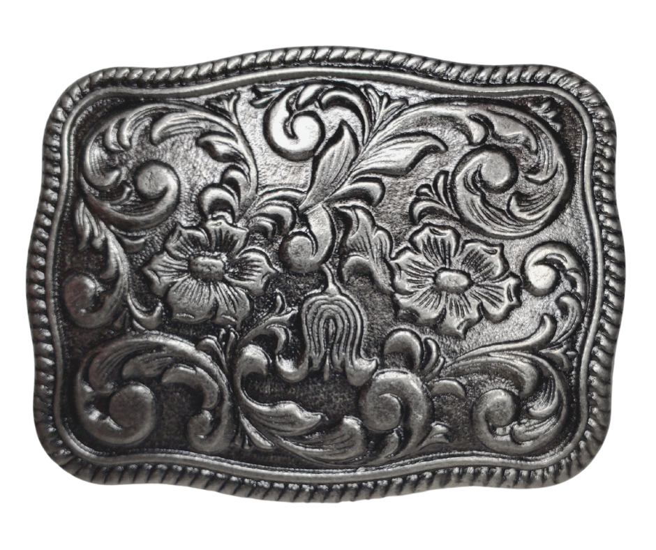 This stylish Western Scroll Belt Buckle is the perfect accessory. Featuring an elegant antique silver western floral pattern, this buckle is sure to elevate any outfit. This belt buckle that may be attached to your belt.  It has a oval shape that Fits 1 1/2" belts, Size approx. 3-1/2" x 2-3/4. Available in our shop just outside Nashville in Smyrna, TN.