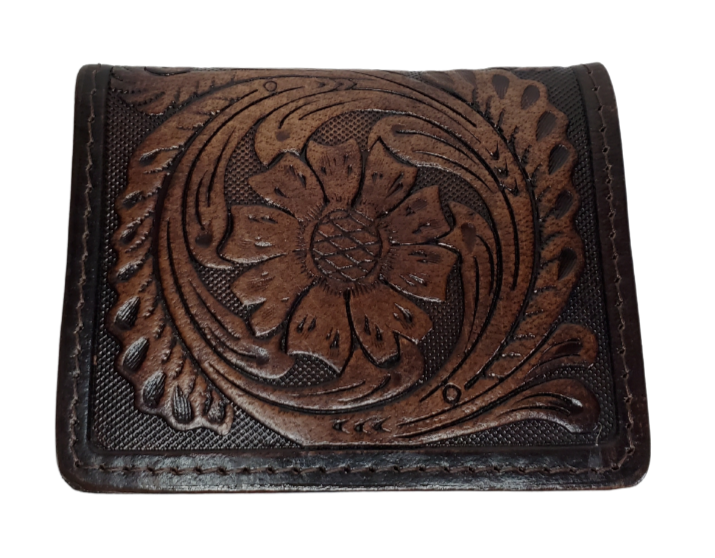 A folded Front Pocket Wallet with a Classic Western Scroll pattern Embossed on the outside and inside pockets with a unique hand stained appearance. Features 2 Credit card slots and 2 Folded cash pockets underneath. Great for the minimalist attitude at a folded 3"x 4" size. Available online and in our retail shop in Smyrna, TN, just outside of Nashville. Imported