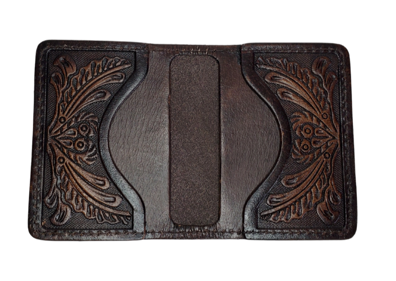 A folded Front Pocket Wallet with a Classic Western Scroll pattern Embossed on the outside and inside pockets with a unique hand stained appearance. Features 2 Credit card slots and 2 Folded cash pockets underneath. Great for the minimalist attitude at a folded 3"x 4" size. Available online and in our retail shop in Smyrna, TN, just outside of Nashville. Imported