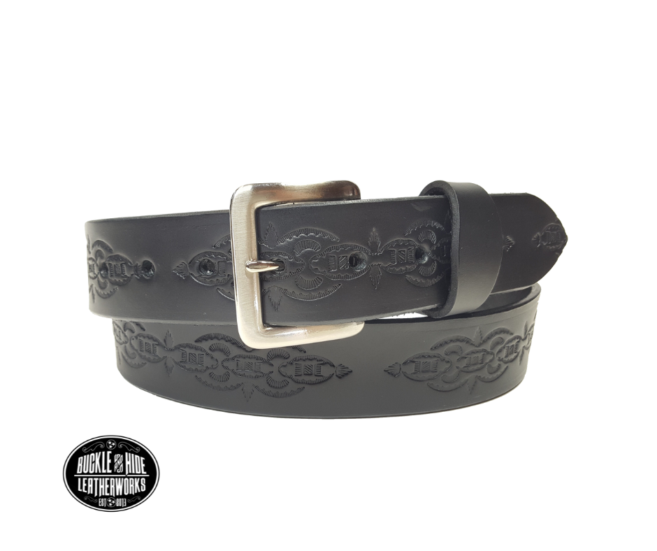 The Williamson handmade all leather belt is made from a single strip of Veg-Tan cowhide that is a hand finished Veg-tan that is 9-10 oz., or approx. 1/8" thick and is 1 1/2" thick. It has an Vintage style embossed design that is never out of style!  The antique nickel plated solid brass buckle is snapped in place. This belt is made just outside Nashville in Smyrna, TN. Perfect for casual and dress wear, it can be for personal use or for groomsman gifts or other gifts as well. 