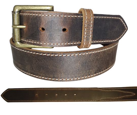 "The Chisholm Trail" is a real leather belt made from a single thick parts of cowhide shoulder leather that is 8-10 oz. or approx. 1/8" thick. It is assembled in 3 main sections 2 billets or end parts and the main center section.  The buckle is antique nickel plated and is snapped in place for easy buckle change.  This belt is stocked in our shop in Smyrna, TN just outside Nashville.