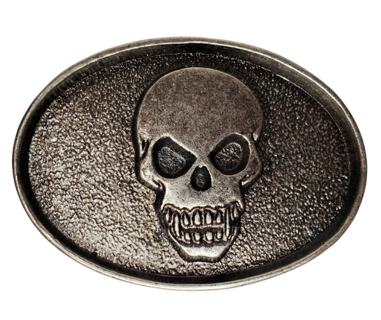 The Biker Skull Belt Buckle is an antique silver design that is sure to add a unique touch to any accessory. Crafted with a detailed skull head, this buckle is perfect for those looking for an edgy yet stylish addition to their wardrobe.  Pewter belt buckle that may be attached to your belt.  It has a oval shape that Fits 1 1/2" belts, Size approx. 3-1/2" x 2-3/4. Available in our shop just outside Nashville in Smyrna, TN.