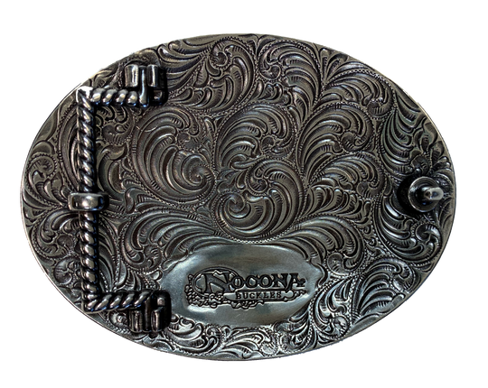 Antique silver with Black stars with a ornate western scroll in the background. Oval shape is good for most body types without digging in to your mid section. Fits up to 1  1/2" belts. Dimensions are approx. 3 1/4" tall x 4 1/4"wide.